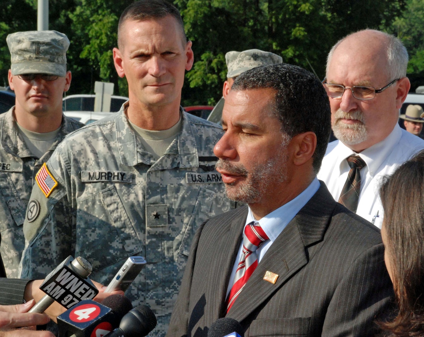 Army Brig. Gen. Patrick Murphy (left) joins New York Gov. David Paterson at a press conference in Gowanda, N.Y., on Aug. 12, 2009, during which Paterson announced that the New York Army National Guard's 152nd Engineer Support Company had been mobilized to clean up the village following a flash flood.