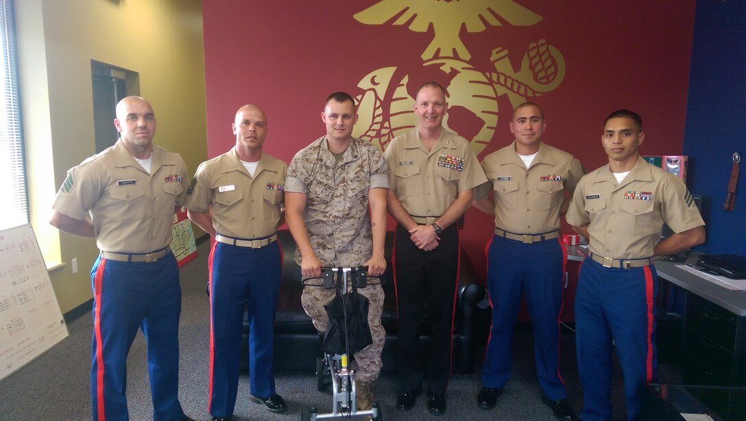 U.S. Marine Corps Maj. Gen. Mark A. Brilakis, the commanding general of Marine Corps Recruiting Command, poses for a photo with the Marines of Recruiting Station Detroit at their recruiting sub-stations Aug. 5, 2014. Brilakis took the opportunity, while visiting RS Detroit, to familiarize himself with the daily operations of recruiters and the challenges they face while recruiting for the Marine Corps. During the visit, Brilakis spoke with recruiters and Marines fresh from Marine Corps Recruit Depot Parris Island, South Carolina. (U.S. Marine Corps courtesy photo/Released)