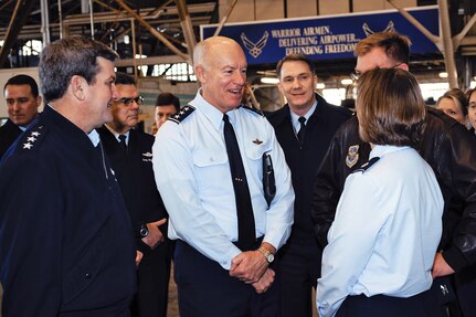 Lt. Gen. Vern "Rusty" Findley, vice commander of Air Mobility Command, left, looks on as Lt. Gen. Harry Wyatt, the director of the Air National Guard, congratulates Lt. Col. Lisa McLeod on her latest promotion as the Washington Air National Guard's 141st Air Refueling Wing's maintenance squadron commander. Wyatt visited Fairchild Air Force Base, Wash., on Feb. 1, 2010.