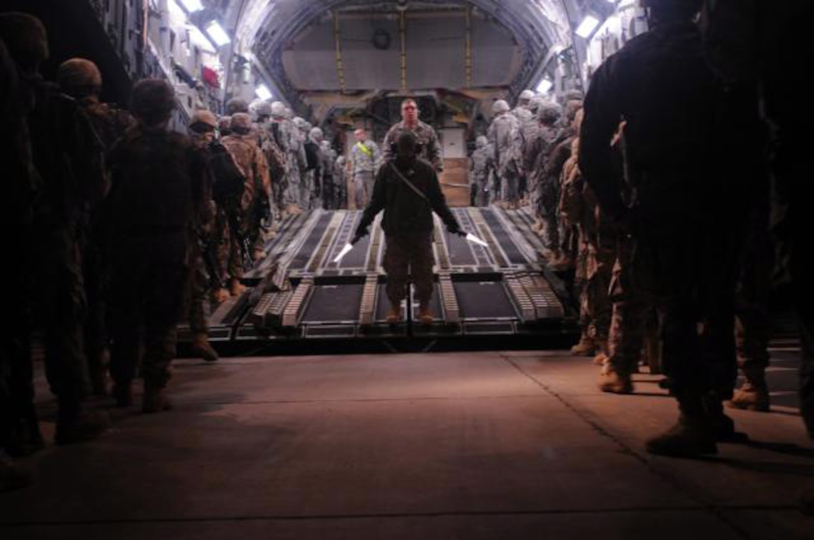 Redeploying Soldiers with the 1st Heavy Brigade Combat Team, 1st Cavalry Division, file onto a C-17 Globemaster III Jan. 26 at Camp Taji, Iraq. More than 8,000 Soldiers left Camp Taji and Baghdad International Airport in a 16-day period, marking the first fixed-wing redeployment operation from Iraq.