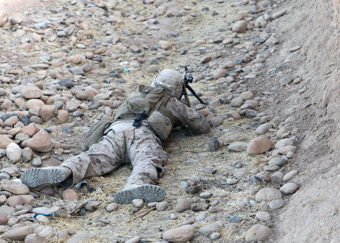 A Marine with Bravo Company, 1st Battalion, 2nd Marine Regiment, provides security during an operation in Helmand province, Sept. 9, 2014. During the 72-hour operation, Marines and Afghan National Army soldiers conducted dismounted patrols on foot to search nearby compounds for weapons and lethal aid. (U.S. Marine Corps photo by Cpl. Cody Haas/ Released)