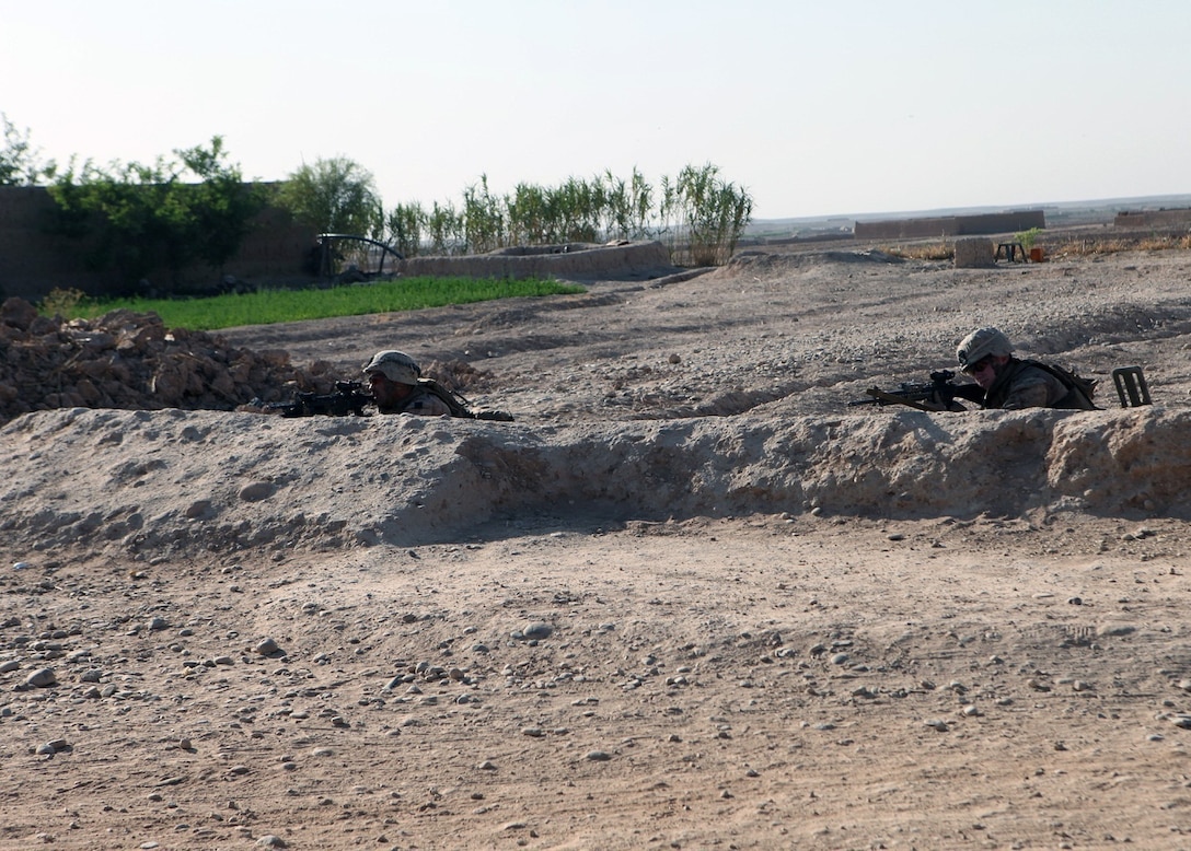 Marines with Bravo Company, 1st Battalion, 2nd Marine Regiment, provide security during an operation in Helmand province, Sept. 9, 2014. During the 72-hour operation, Marines and Afghan National Army soldiers conducted dismounted patrols on foot to search nearby compounds for weapons and lethal aid. (U.S. Marine Corps photo by Cpl. Cody Haas/ Released)