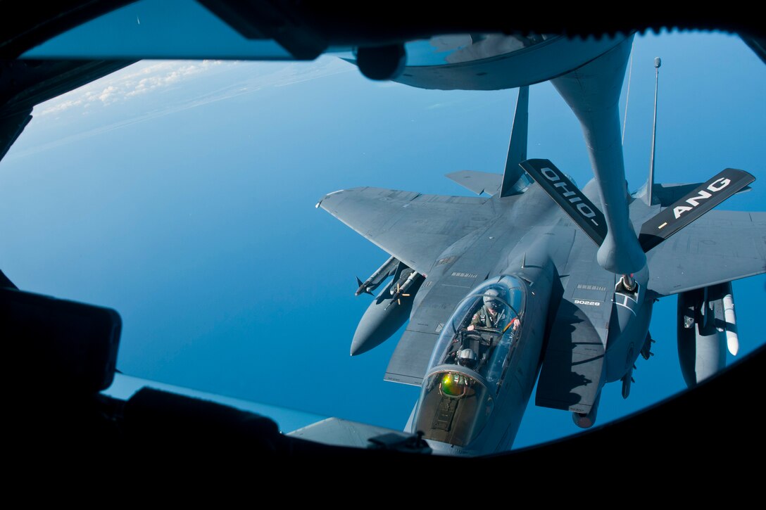 Members of the 121st Air Refueling Wing refuel an F-15E Strike Eagle using a KC-135A Stratotanker Sept. 11, 2014, off the coast of North Carolina during an exercise. The 121st ARW is from the Rickenbacker Air National Guard Base, Ohio. (U.S. Air National Guard photo/Airman 1st Class Wendy Kuhn)