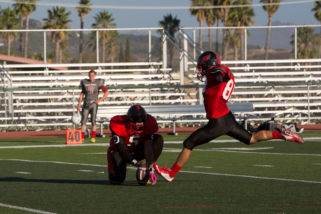 Juan Reyes, Marine Corps Air Station Miramar Falcons’ kicker, kicks the ball in for a field goal during a game against the 11th Marines Cannon Cockers at Paige Fieldhouse aboard Marine Corps Base Camp Pendleton, Calif., Sept. 17. This is the Falcons’ third win of the season. 