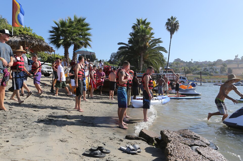 Marines with the 3rd Marine Aircraft Wing wait for jet skis during Operation Adrenaline Rush event at Carlsbad Lagoon, Calif., Sept. 17. The Marine Corps Community Services program allows units to combat operational stress while participating in recreational activities.