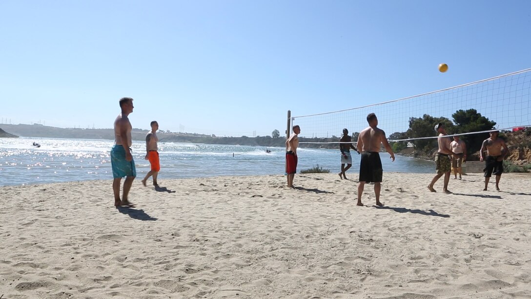 Marines with the 3rd Marine Aircraft Wing play a game of volleyball during Operation Adrenaline Rush event at Carlsbad Lagoon, Calif., Sept. 17. The Marine Corps Community Services Program combines combat and operational stress control principles with an outdoor recreation adventure activity to mitigate boredom and high-risk behavior.