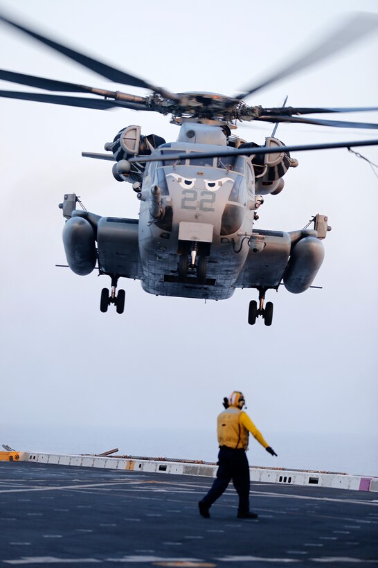 A CH-53E Super Stallion with Marine Medium Tiltrotor Squadron 163 (Reinforced), 11th Marine Expeditionary Unit (MEU), lands on the on the flight deck during a simulated casualty evacuation drill conducted aboard the USS San Diego (LPD 22), Sept 16.  The USS San Diego is part of the Makin Island Amphibious Ready Group and, with the embarked 11th Marine Expeditionary Unit, is deployed in support of maritime and theater security operations in the U.S. 5th Fleet area of responsibility. (U.S. Marine Corps photos by Gunnery Sgt. Rome M. Lazarus/ Released)