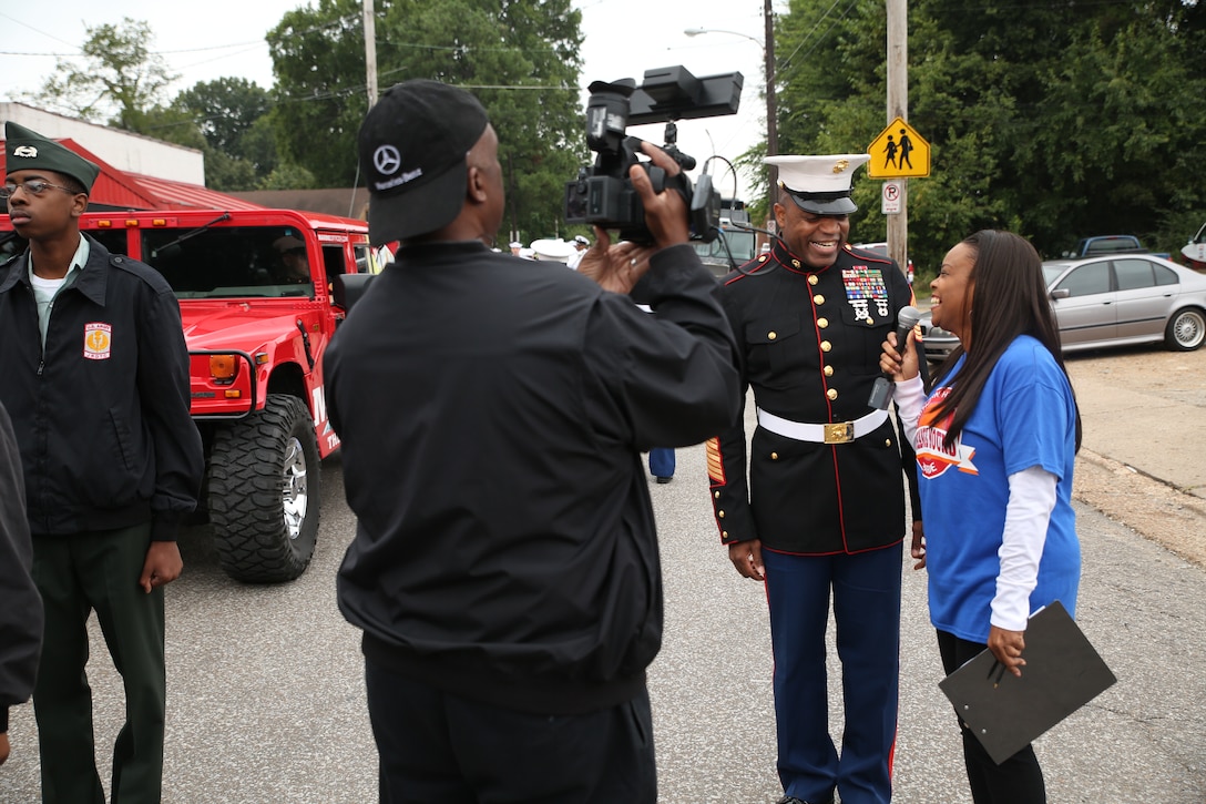 Sgt. Maj. Michael Logan, Marine Corps Recruiting Command sergeant major, speaks to Orange Mound neighborhood media before the Southern Heritage Classic parade Sept. 13 in Memphis, Tenn. Marines attended the 25th annual Southern Heritage Classic to provide students and staff with relevant information and potentially attract qualified individuals. Throughout the celebration, Marines spoke with influential individuals and were able to provide a positive impact to the community, strengthening the Corps' patriotic image. (U.S. Marine Corps photo by Cpl. Stanley Cao/Released)