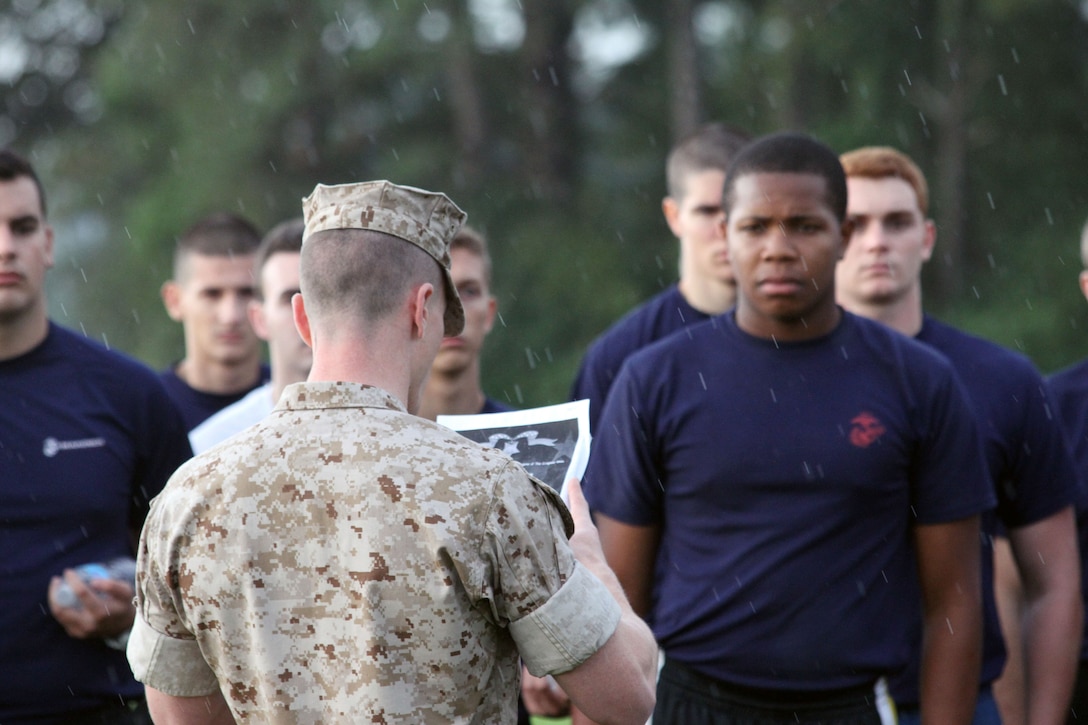 Maj. Charles C. Nash, commanding officer, Marine Corps Recruiting Station Columbia, reads the Medal of Honor citation for Cpl. Kyle Carpenter to the poolees of RS Columbia before the Initial Strength Test portion of the Ship Validation at Fort Jackson, on Sept. 19, 2014. The poolees attending will be shipping off to Basic Training within the next month.