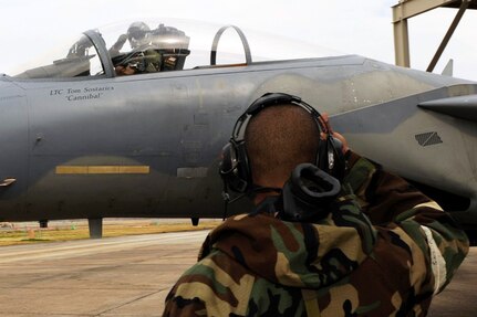 Louisiana National Guardsman Maj. John Freed gives Tech.
 Sgt. Brandon Ayler a thumbs-up before taxiing down the flight line during an Operational Readiness Exercise at Naval Air Station - Joint Reserve Base in New Orleans, Jan. 30, 2010. The 159th Fighter Wing is performing the exercise to ensure all Guardsmen meet deployment requirements in preparation for an upcoming Operational Readiness Inspection.