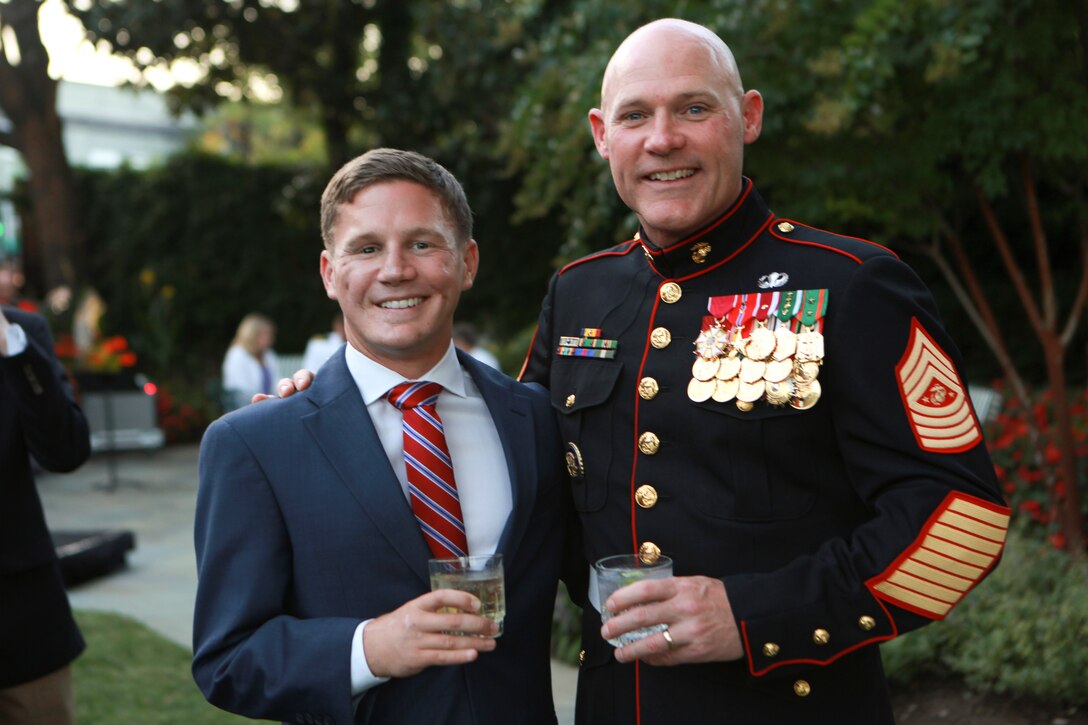 Sgt. Maj. Micheal P. Barrett, the 17th Sergeant Major of the Marine Corps, and Medal of Honor recipient Cpl. Kyle Carpenter attend a reception prior to the final evening parade of the season at Marine Barracks Washington, D.C., on Aug. 29, 2014. (U.S. Marine Corps photo by Sgt. Marionne T. Mangrum)