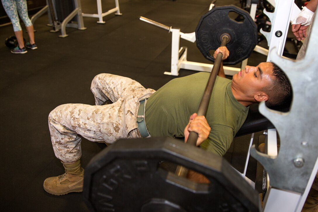 Cpl. Jonathan Soriano, Supply Repairable Control Branch noncommissioned officer in charge with Marine Aviation Logistics Squadron (MALS) 11, performs a bench press during an afternoon workout aboard Marine Corps Air Station Miramar, Calif., Sept. 19. Soriano realized he had a passion for fitness and since then he passes on everything he learns from college classes and experience to his Marines shortly after enlisting in the Marine Corps.