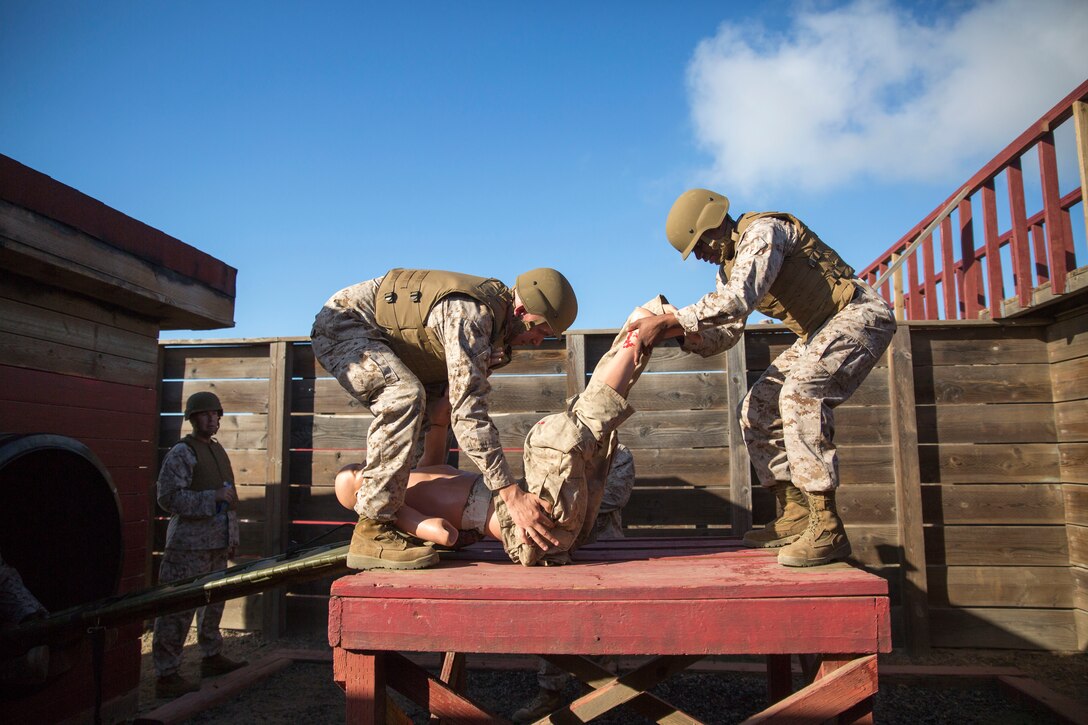 U.S. Marine Corps Career Recruiters, 12th Marine Corps District, engage in the Leadership Reaction Course (LRC)during the Career Recruiter Conference aboard Camp Pendleton, Calif., Sept. 18, 2014. The LRC establishes teamwork, problem solving skills, and builds camaraderie amongst the Marines. (U.S. Marine Corps photo by Cpl. Catie Massey/ Released)