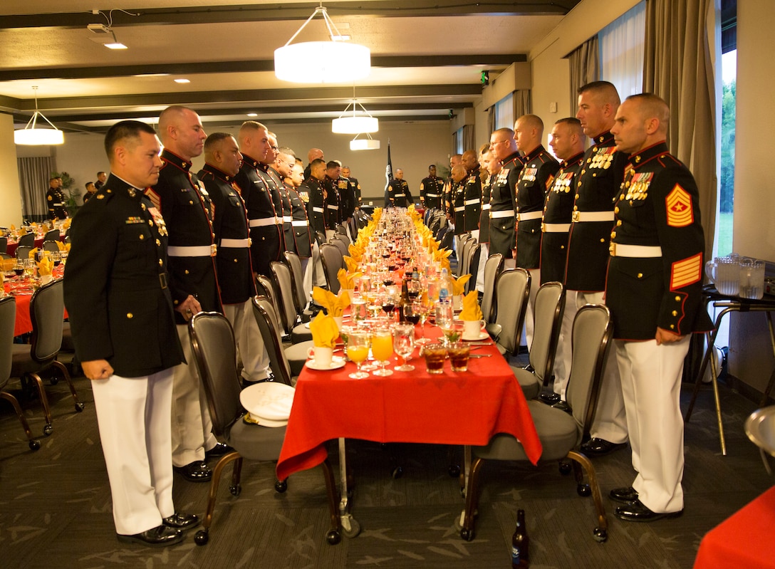 U.S. Marine Corps Career Recruiters, 12th Marine Corps District, celebrate during a Mess Night to mark the end of the Career Recruiter Conference aboard MCAS Miramar, Sept. 18, 2014. The Mess Night is a borrowed tradition of ceremonial dining, and has become an honored tradition of enjoying drink, good food, and fellowship with a Marine's comrades, as well as honoring those who have perished in battle.  (U.S. Marine Corps photo by Cpl. Catie Massey/ Released)