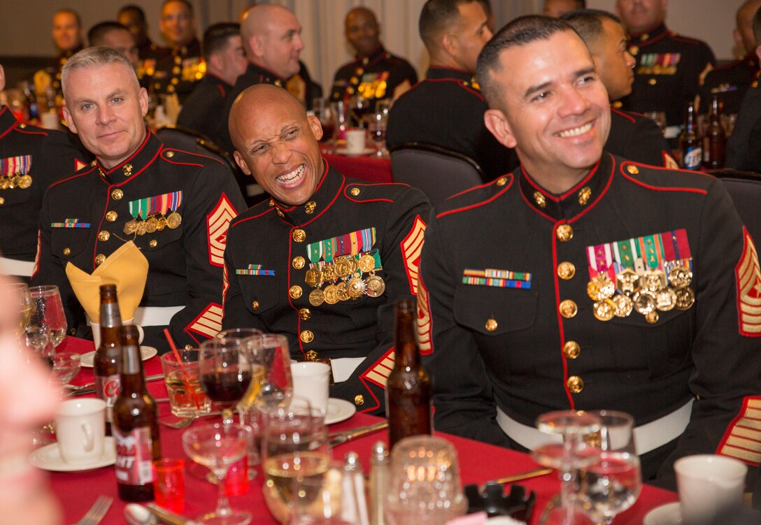 U.S. Marine Corps Career Recruiters, 12th Marine Corps District, celebrate during a Mess Night to mark the end of the 8412 Conference aboard MCAS Miramar, Sept. 18, 2014. The Mess Night s a borrowed tradition of ceremonial dining. Originally a British Army tradition, it has become an honored tradition of enjoying drink, good food, and fellowship with a Marine's comrades, as well as honoring those who have perished in battle.  (U.S. Marine Corps photo by Cpl. Catie Massey/ Released)