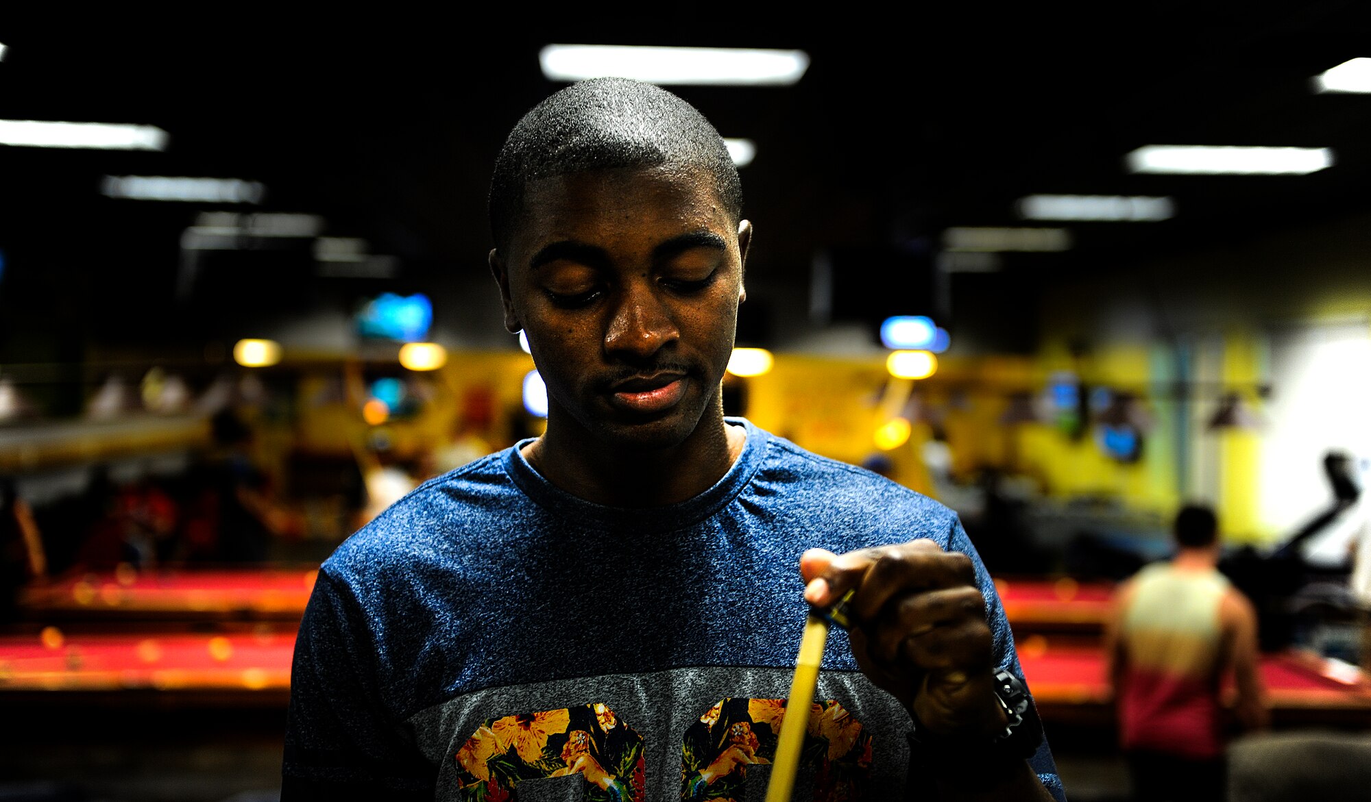 Airman 1st Class Andrew Axson, 1st Special Operations Security Forces Squadron entry controller, plays a round of pool at the Landing Zone on Hurlburt Field, Fla., Sept. 11, 2014. The Hurlburt Airman’s Voice hosted a pool tournament to help Airmen and their families relax from the fast pace Special Operations mission. (U.S. Air Force photo/Senior Airman Christopher Callaway) 