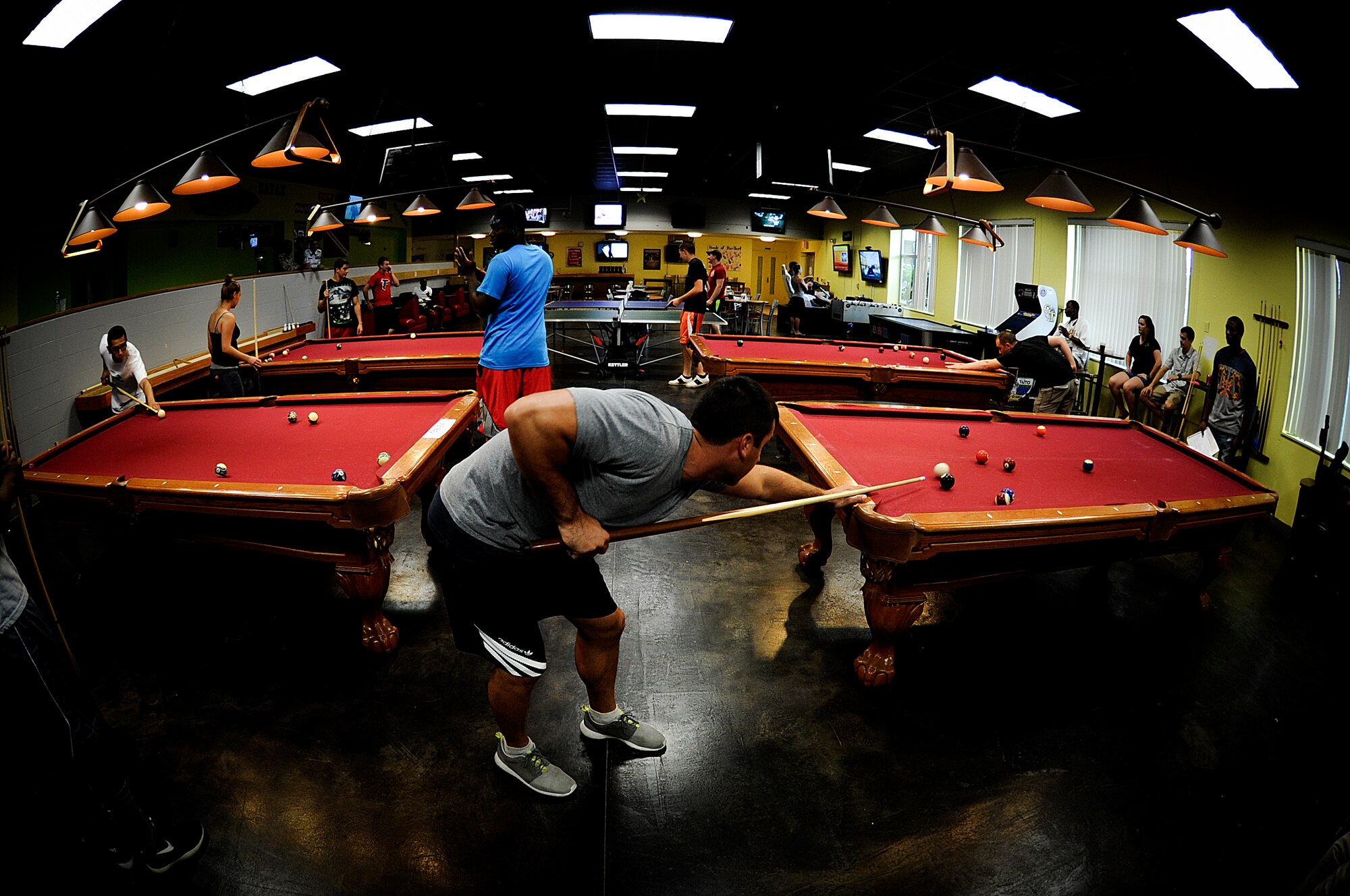 Airman Jake Lomonaco, 342nd Training Squadron Tactical Air Control Party trainee, plays pool at the Landing Zone on Hurlburt Field, Fla., Sept. 11, 2014. Hurlburt Airman’s Voice hosted a pool tournament to help Airmen and their families relax from the fast pace Special Operations mission. (U.S. Air Force photo/Senior Airman Christopher Callaway) 