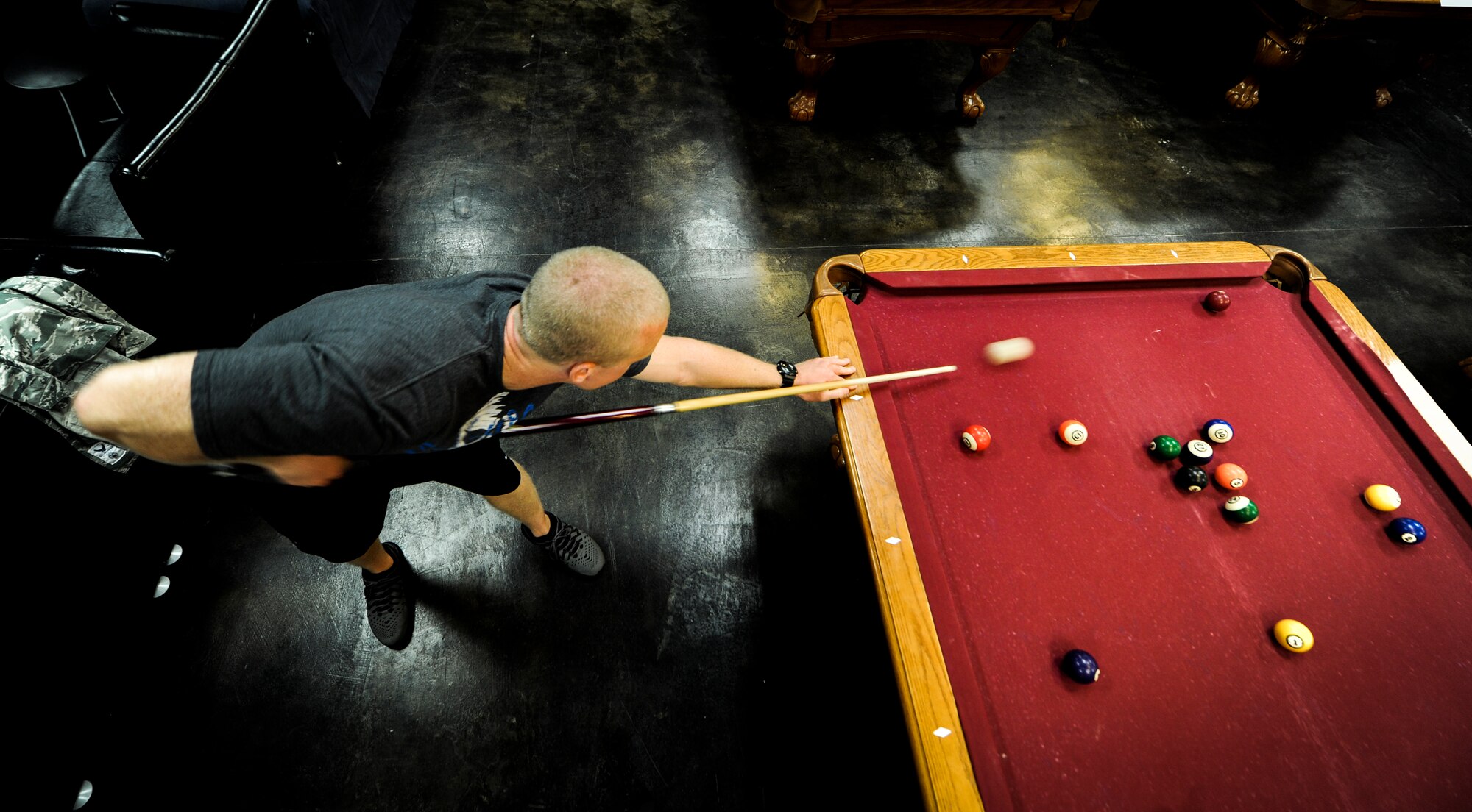 Airman 1st Class Tyler Sullivan, 342nd Training Squadron member, plays a game of pool at the Landing Zone on Hurlburt Field, Fla., Sept. 11, 2014. Sullivan participated in a pool tournament held by the Hurlburt Airman’s Voice; an organization ran by Airmen, E-1 through E-4. (U.S. Air Force photo/Senior Airman Christopher Callaway) 