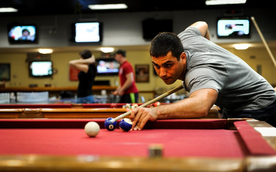 Airman Jake Lomonaco, 342nd Training Squadron Tactical Air Control Party trainee, plays billiards at the Landing Zone on Hurlburt Field, Fla., Sept. 11, 2014. Lomonaco participated in a pool tournament held by the Hurlburt Airman’s Voice; an organization ran by Airmen, E-1 through E-4. (U.S. Air Force photo/Senior Airman Christopher Callaway) 