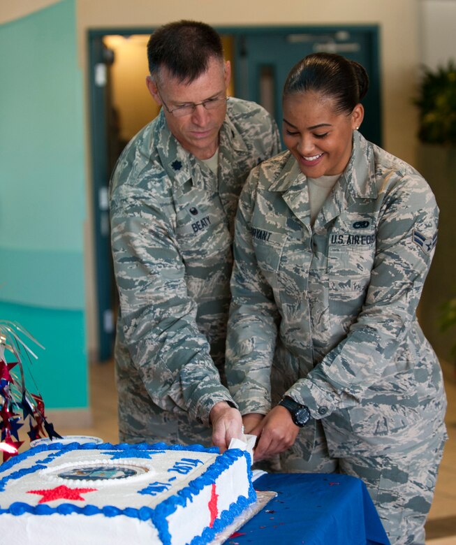 Lt. Col. James Beaty, 1st Special Operations Wing Force Support Squadron commander, and Airman 1st Class Kelsey Bryant, 1st Special Operations Aircraft Maintenance Squadron weapons load crew apprentice and the youngest Airman stationed at Hurlburt Field, Fla., cut an Air Force birthday cake at the Riptide Dining Facility, Sept. 18, 2014. The Riptide Dining Facility prepared a special meal, along with a cake to celebrate the Air Force’s 67th anniversary. (U.S. Air Force photo/Senior Airman Krystal M. Garrett) 
