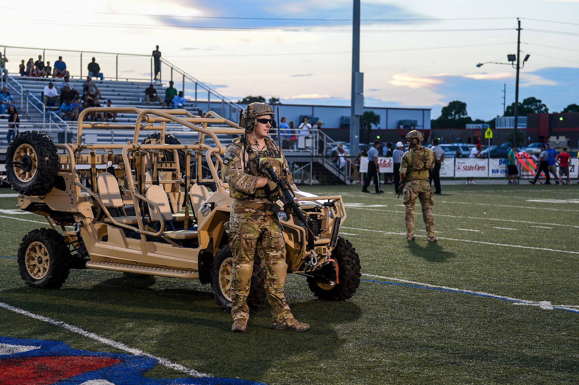 Members of the Special Tactics Training Squadron perform a capabilities demonstration at Fort Walton Beach High School, Fort Walton Beach, Fla., Sept. 12, 2014. F W B High School hosted the 24th Special Operations Wing for the school’s annual Military Appreciation Night. (U.S. Air Force photo/Airman 1st Class Jeff Parkinson)