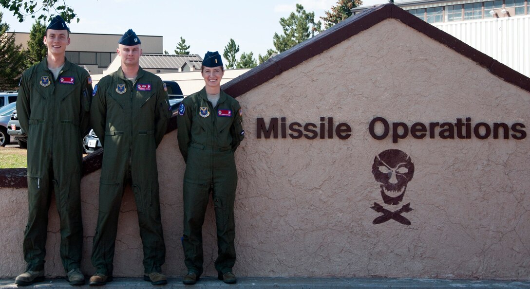 The 319th Missile Squadron 2014 Global Strike Challenge team:  1st Lt. Kyle Buckmiller, Capt. Daniel Cook and 2nd Lt. Amber Moore. (U.S. Air Force photo by Airman 1st Class Brandon Valle)