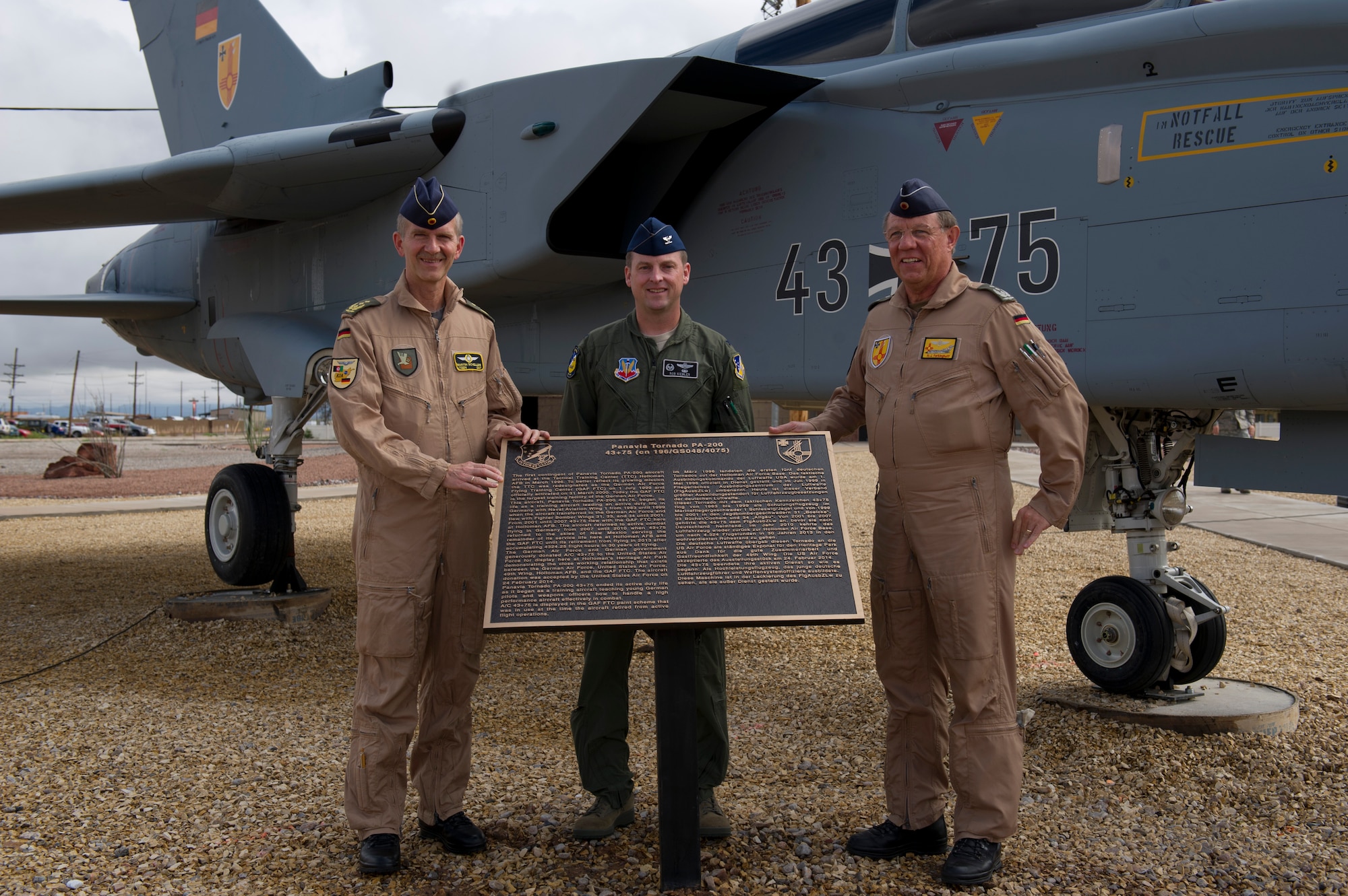 Lieutenant Gen. Martin Schellis, German Operational Forces Command commander, Col. Robert Kiebler, 49th Wing commander, and Col. Heinz Ferkinghoff, German Air Force Flying Training Center commander unveil the Tornado 43+75 plaque at Holloman Air Force Base’s Heritage Park Sep. 19. History was made Sep. 19, when a German Air Force static aircraft was unveiled in Heritage Park by Schellis and Kiebler. The GAF Training Center and the Tornados are a significant part of military aviation operations in and around Holloman Air Force Base and White Sands Missile Range. (U.S. photo by Staff Sgt. E’Lysia Wray/ Released)