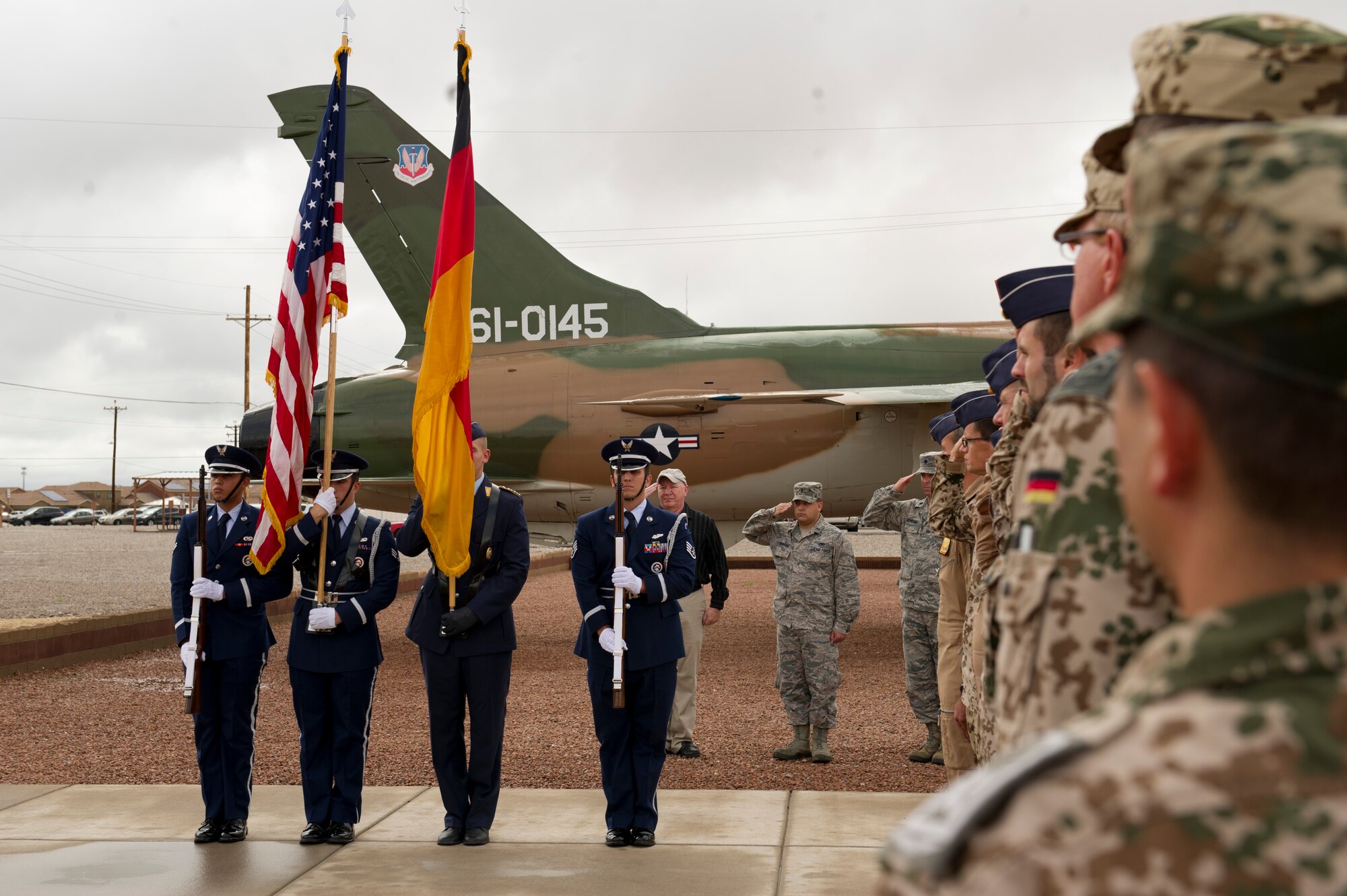 Holloman Air Force Base’s Steel Talons and Luftwaffe Honor Guard present the colors at the unveiling ceremony for the Tornado 43+75 in Heritage Park. History was made Sep. 19, when a German Air Force static aircraft was unveiled in Heritage Park by Lt. Gen. Martin Schellis, German Air Force Operational Forces Command commander, and Col. Robert Kiebler, 49th Wing commander. The GAF Training Center and the Tornados are a significant part of military aviation operations in and around Holloman Air Force Base and White Sands Missile Range. (U.S. photo by Staff Sgt. E’Lysia Wray/ Released)