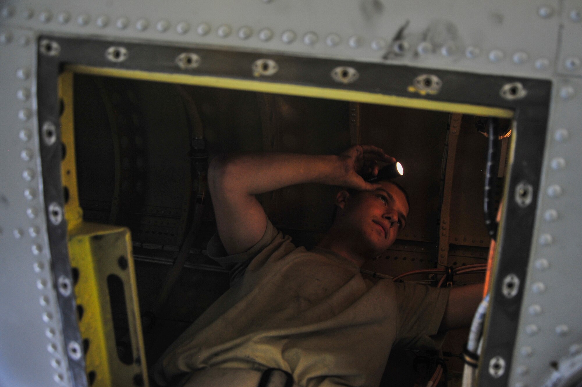 U.S. Air Force Airman 1st Class Brennen Taylor, 355th Equipment Maintenance Squadron crew chief, performs a phase inspection on an A-10C Thunderbolt II at Davis-Monthan Air Force Base, Ariz., Sept. 16, 2014. During a phase inspection, the A-10 is given a complete in-depth inspection, searching for foreign object debris, damage, cracked or worn parts and also the phase ensures that every section of the airframe is intact with each piece in proper place.  (U.S. Air Force Photo by Airman 1st Class Chris Massey/Released)