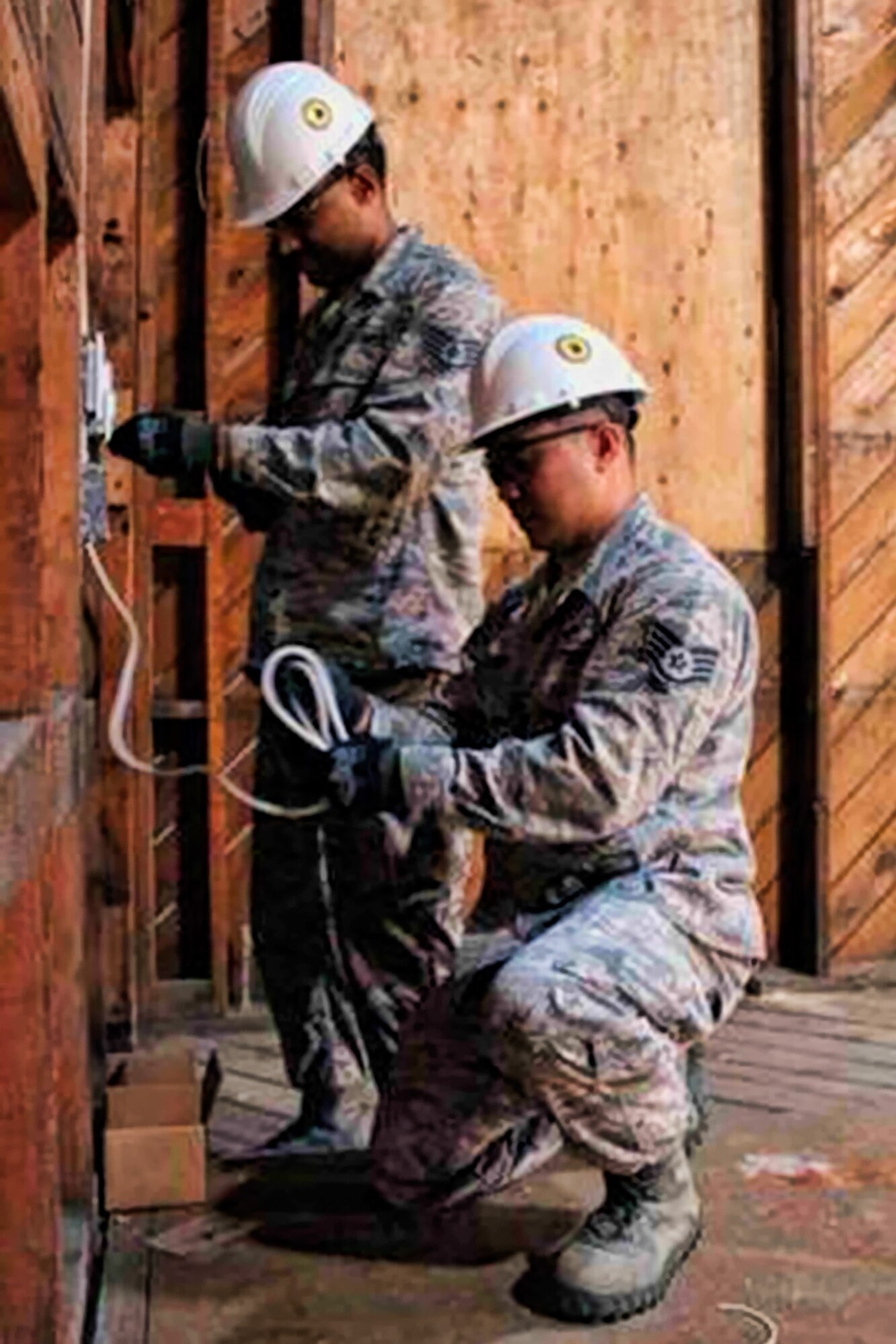 Reservists from the 446th Civil Engineer Squadron here, handle some cables to renovate one of the base's old chapels, and convert it into an Environmental Education and Conference Center. Airmen from the 446th CES worked in tandem with JBLM Public Works and the 176th Engineers from the Washington National Guard to complete the project by the end of the year. (Northwest Guardian)