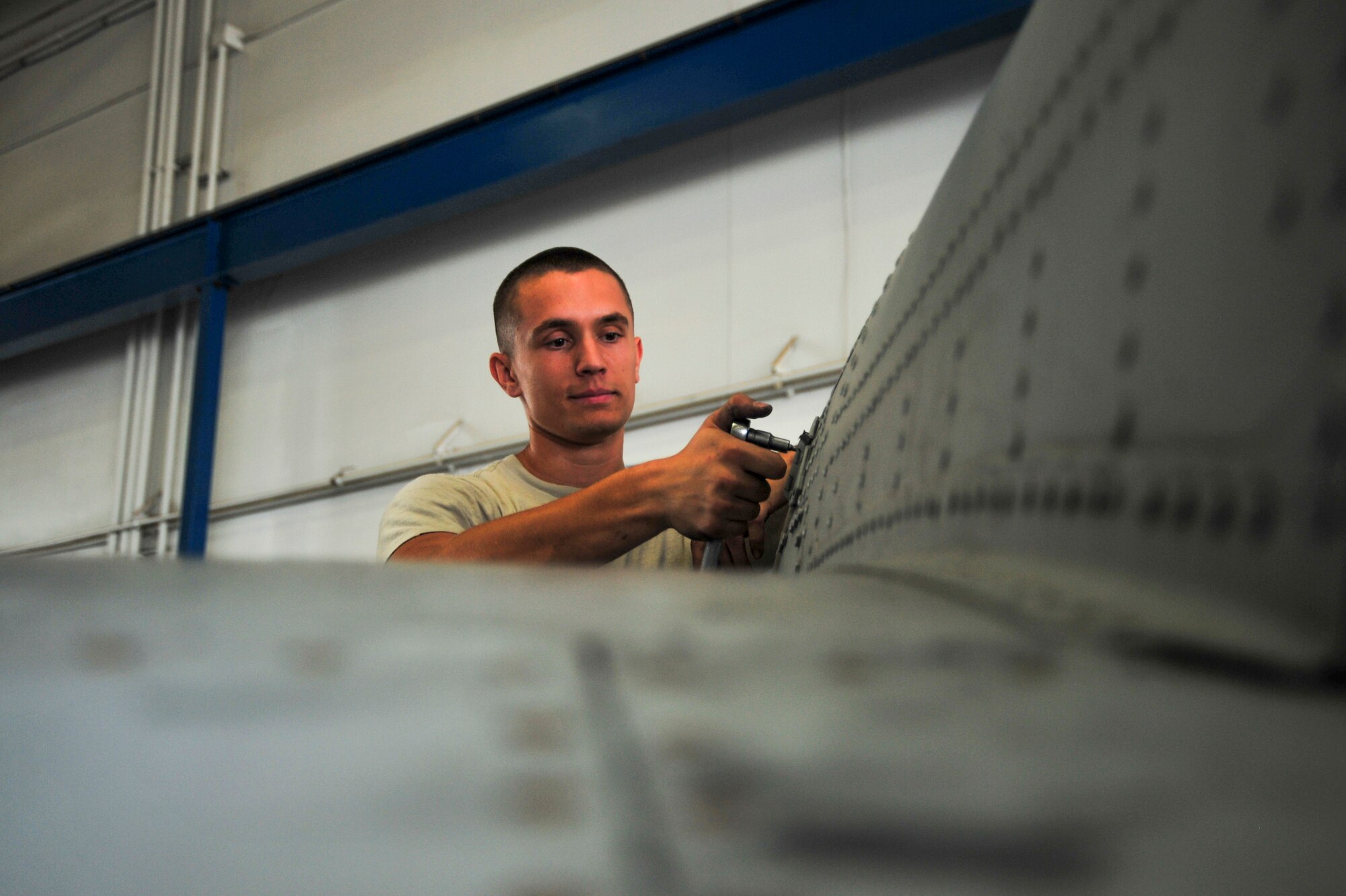 U.S. Air Force Airman 1st Class Michael Stilson, 355th Equipment Maintenance Squadron crew chief, installs a tail cone using tridair fasteners and a torque limiter on an A-10C Thunderbolt II at Davis-Monthan Air Force Base, Ariz., Sept. 16, 2014.  The 355th EMS strives to provide world-class maintenance and munitions support to all aircraft assigned to D-M as well as all transient and tenant aircraft on base. (U.S. Air Force Photo by Airman 1st Class Chris Massey)