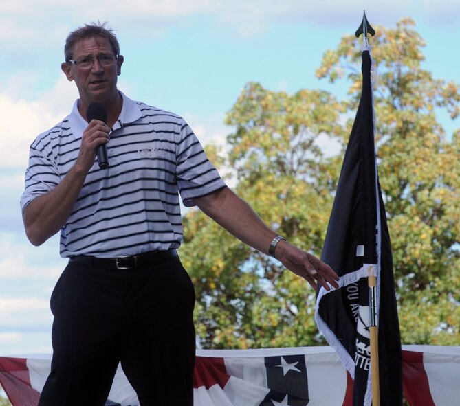 Lt. Col. (Ret.) Richard “Dale” Storr, talks to Team Fairchild before the start of the Prisoner of War and Missing In Action 5k ruck march at Fairchild Air Force Base, Washington, September 19, 2014. Storr is a former prisoner of war who was captured during the Gulf War. Storr retired in June 2011, after 28 years of military service. Participants marched a three-mile course around the base to begin the observance of POW/MIA personnel. (U.S. Air Force photo/Staff Sgt. Samantha Krolikowski)