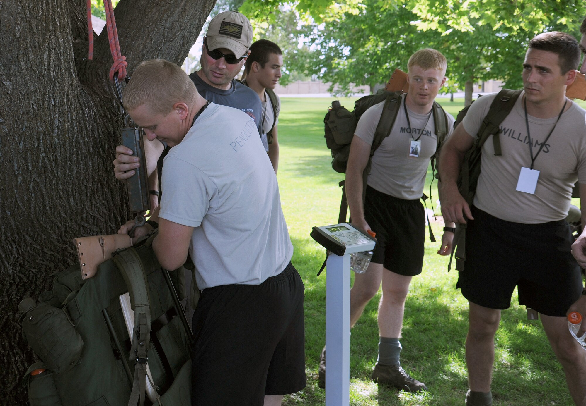 Participants weigh their ruck sacks before the Prisoner of War and Missing In Action 5K ruck march at Faichild Air Force Base, Wash., September 19, 2014. Adults were asked to carry at least 20 pounds in their ruck sack during the march. Participants marched a three-mile course around the base to begin the observance of POW/MIA personnel. (U.S. Air Force photo by Staff Sgt. Samantha Krolikowski/Released)
