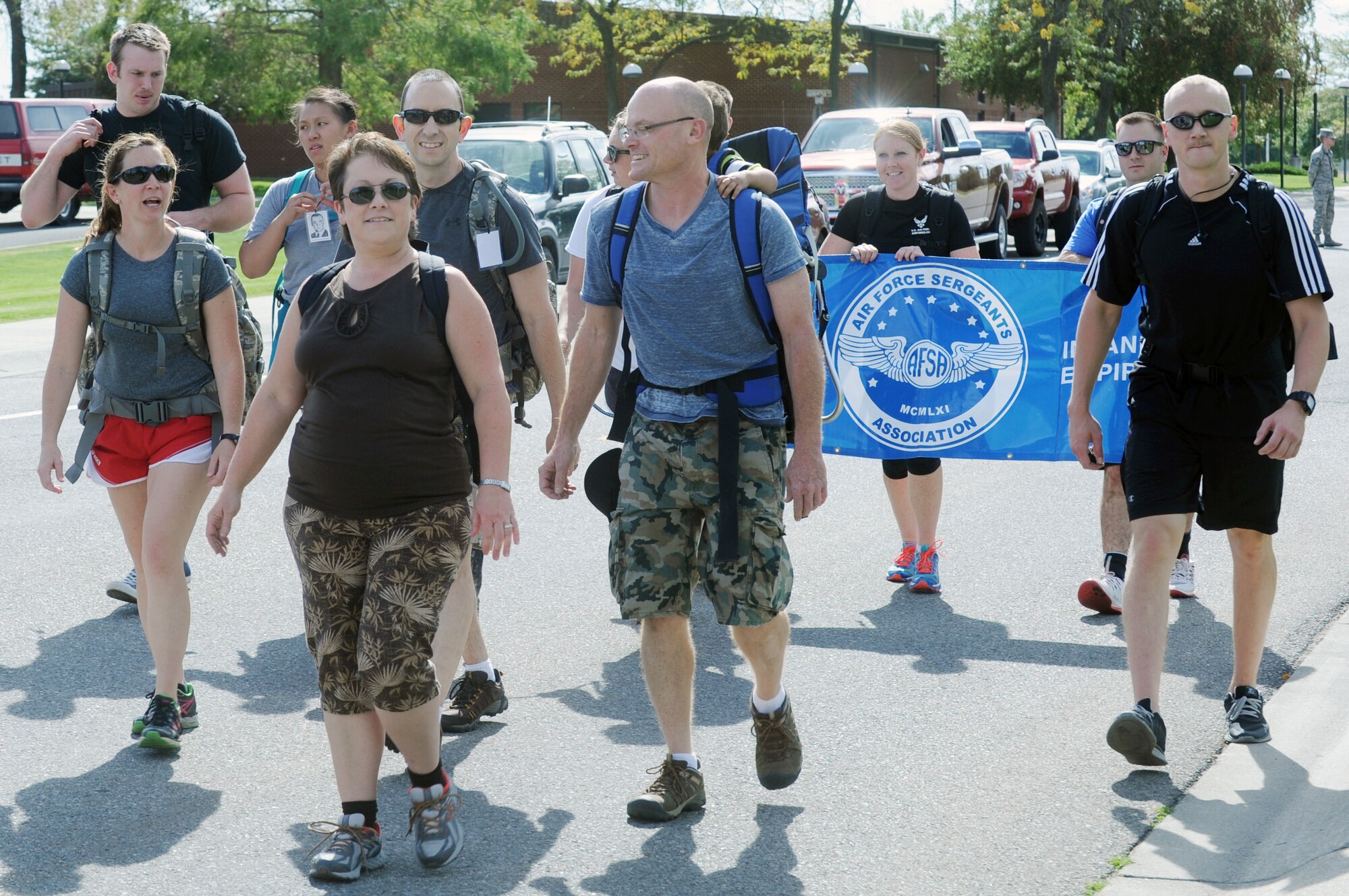 Members of Team Fairchild begin the 5K Prisoner of War and Missing In Action ruck march at Miller Park on Fairchild Air Force Base, Wash., September 19, 2014. Participants took time from their day to ruck and pay tribute to those who were captured, missing or gave their lives while serving their country. Participants marched a three-mile course around the base to begin the observance of POW/MIA personnel. (U.S. Air Force photo by Staff Sgt. Samantha Krolikowski/Released)