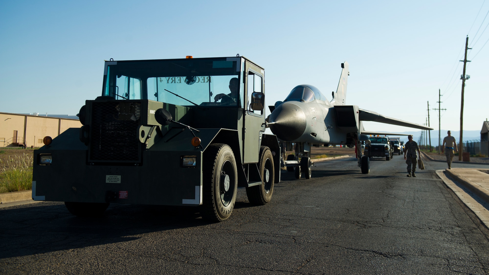 Members of the 49th Maintenance Group crash recovery team transport a German Air Force Tornado static display to Heritage Park to join other historical aircraft which have been flown at Holloman Air Force Base, N.M., July 19. History was made Sep. 19, when a German Air Force static aircraft was unveiled in Heritage Park by Lt. Gen. Martin Schellis, GAF Flying Training Center commander, and Col. Robert Kiebler, 49th Wing commander. The GAF Training Center and the Tornados are a significant part of military aviation operations in and around Holloman Air Force Base and the White Sands Missile Range. (U.S. photo by Airman 1st Class Aaron Montoya / Released)