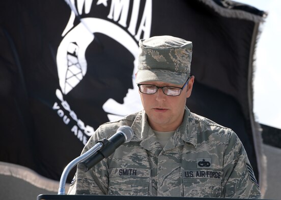 ALTUS AIR FORCE BASE, Okla. – U.S. Air Force Tech. Sgt. Jason Smith, 97th Logistics Readiness Squadron air transportation craftsman, reads a script during a Prisoners of War/Missing in Action Recognition Day retreat ceremony at the Wings of Freedom Park, Sept. 19, 2014. The ceremony was conducted in honor of National POW/MIA Recognition Day, which is observed on the third Friday of September. (U.S. Air Force photo by Senior Airman Franklin R. Ramos/Released)