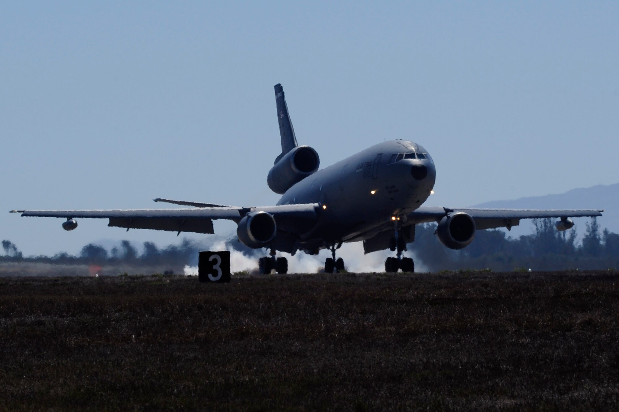 A KC-10 Extender from the 60th Air Mobility Wing taxis the runway, Sept. 15, 2014, Vandenberg Air Force Base, Calif. The aircraft made the trip from Travis Air Force Base, California, for an Air Combat Operations Training Exercise, held by Airmen with the 570th Contingency Response Group, Sept. 15 through 17. (U.S. Air Force photo by Senior Airman Shane Phipps/Released)

