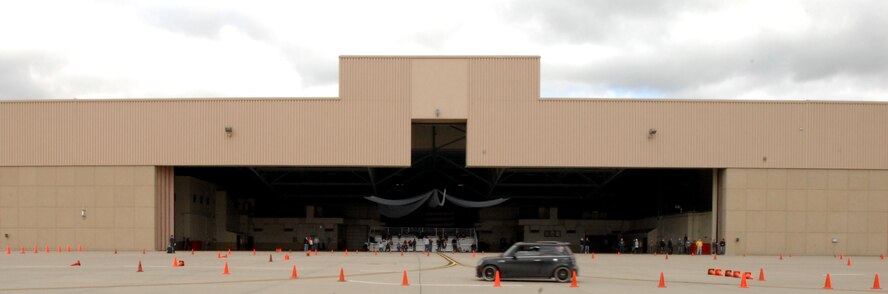 A racer navigates through the driving course at the Autocross event held Sept. 14, 2014, at the free zone in front of the 3-Bay Hangar here. Nearly 60 entrants driving cars of every make and model participated in the day-long event, with proceeds going to benefit the Wounded Warrior Project. (U.S. Air Force photo/Staff Sgt. Susan L. Davis)