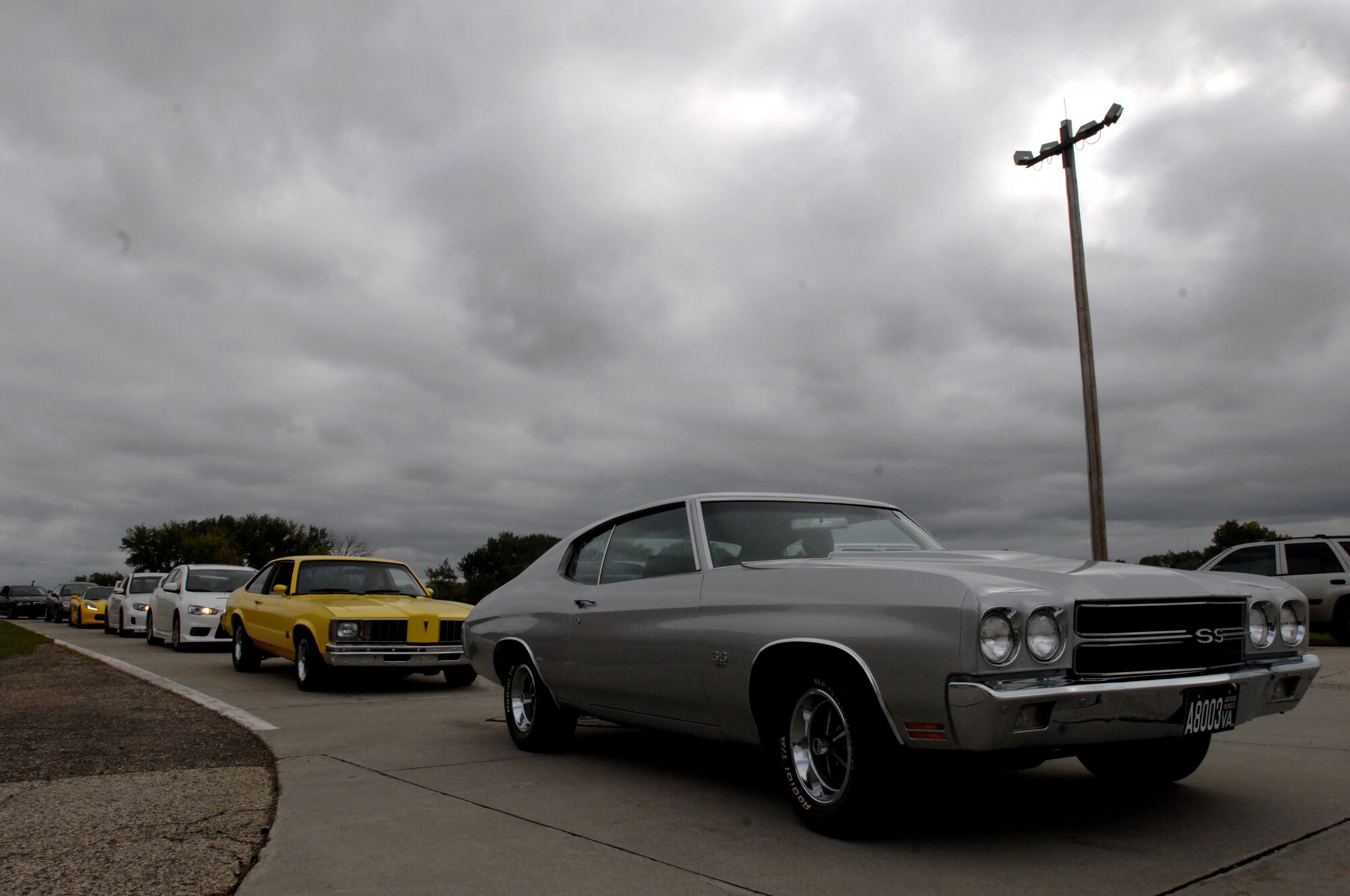 Autocross participants line up at the starting line at the Autocross event held Sept. 14, 2014, at the free zone in front of the 3-Bay Hangar on Grand Forks Air Force Base, N.D. Nearly 60 entrants driving cars of every make and model participated in the day-long event, with proceeds going to benefit the Wounded Warrior Project. (U.S. Air Force photo/Staff Sgt. Susan L. Davis)