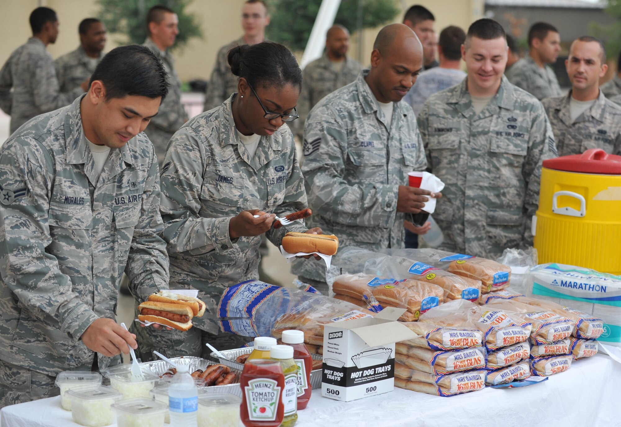 Sheppard’s Rising 6 hosted a cookout style lunch at the Community Activities Center outdoor pavilion Sept. 18, 2014, in honor of the 67th birthday of the U.S. Air Force. The Rising 6 is the junior enlisted council, made up of members from airman basic to tech. sgt. The Rising 6 grilled hundreds of hotdogs, provided flavored shaved ice and a birthday cake for the celebration of a 67-year heritage. (U.S. Air Force photo/Airman 1st Class Robert L. McIlrath)


