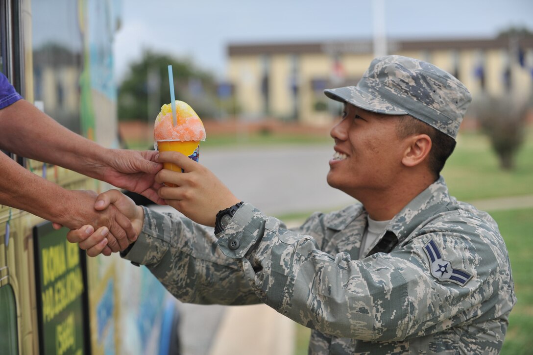 Sheppard’s Rising 6 hosted a cookout style lunch at the Community Activities Center outdoor pavilion Sept. 18, 2014, in honor of the 67th birthday of the U.S. Air Force. The Rising 6 is the junior enlisted council, made up of members from airman basic to tech. sgt. The Rising 6 grilled hundreds of hotdogs, provided flavored shaved ice and a birthday cake for the celebration of a 67-year heritage. (U.S. Air Force photo/Airman 1st Class Robert L. McIlrath)

