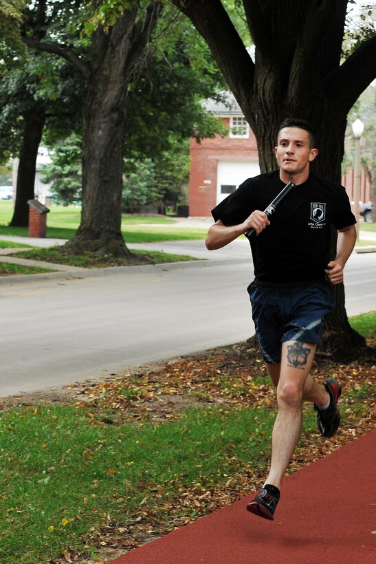 U.S. Senior Airmen Tyler Davis, U.S. Strategic Command, runs around the parade grounds during the inaugural the Prisoner of War/Missing in Action Memorial 24-Hour Run held Sept. 19-20, Offutt Air Force Base, Nebraska. Many Americans across the United States pause on the third Friday of September each year to remember the sacrifices and service of those who were POWs as well as those who are MIA and their families. (U.S. Air Force Photo by Charles Haymond)