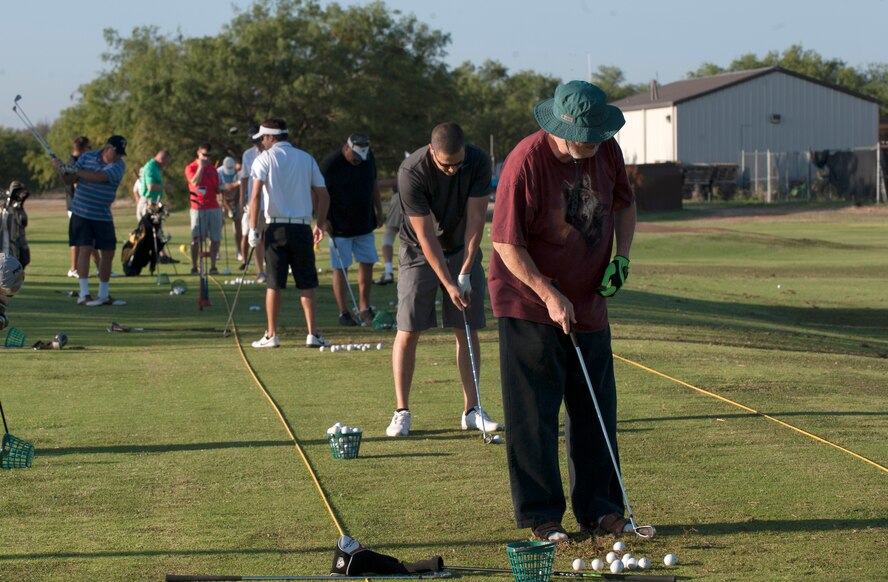Golfers prepare for the Salute to Your Service golf tournament Sept. 5, 2014, at Dyess Air Force Base, Texas. Eighty golfers signed up to play the 18-hole course to help fund a new house for Michael Burns, a local wounded combat veteran. (U.S. Air Force photo by Airman 1st Class Alexander Guerrero/Released)