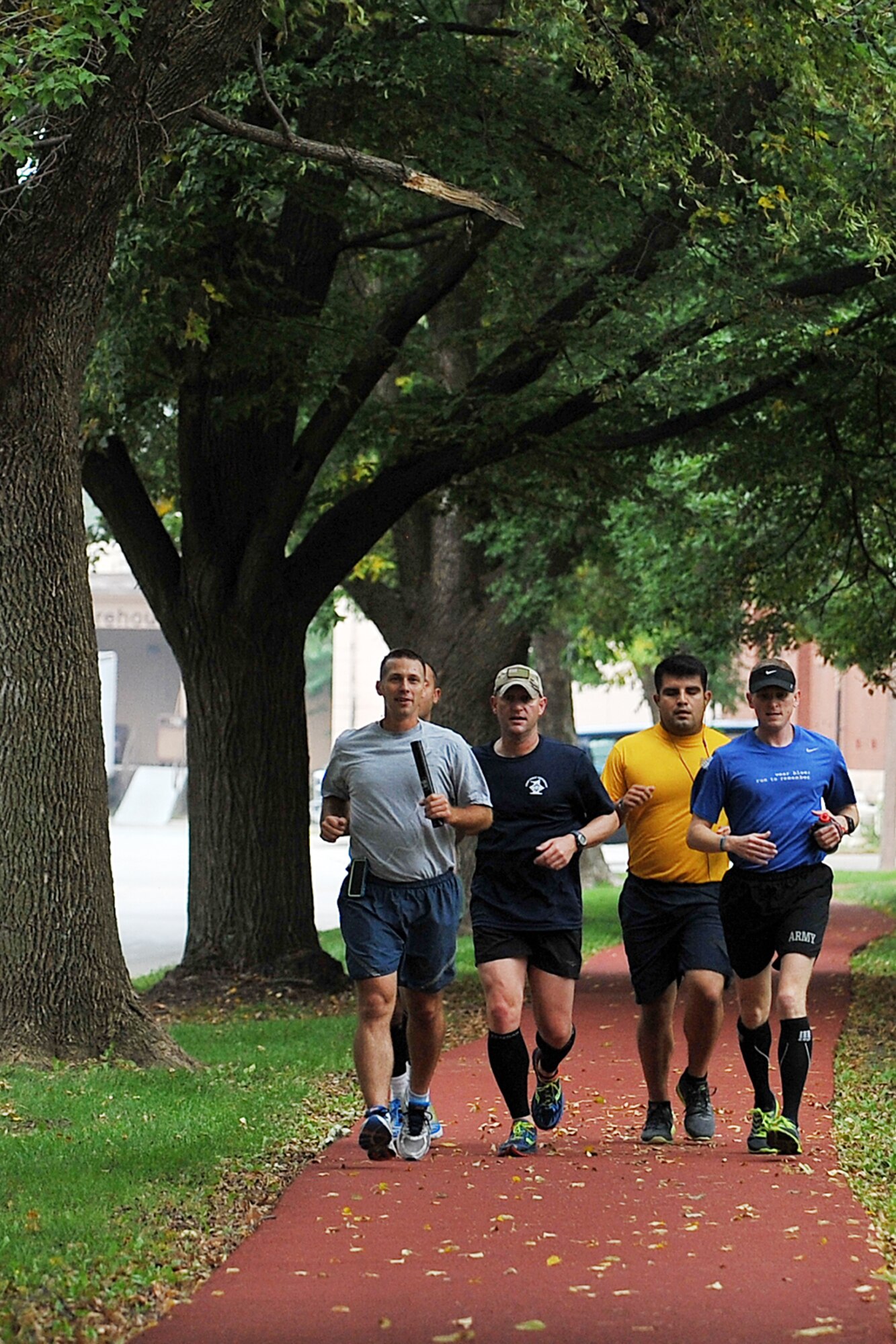 U.S. Strategic Command personnel run around the parade grounds as part of the inaugural the Prisoner of War/Missing in Action Memorial 24-Hour Run held Sept. 19-20, Offutt Air Force Base, Nebraska. The United States’ National POW/MIA Recognition Day is observed across the nation on the third Friday of September each year. (U.S. Air Force Photo by Charles Haymond)