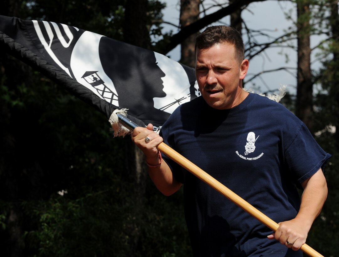 Members of Joint Base Andrews participate in the 24-hour POW/MIA Vigil Run here Sept. 18-19. More than 400 military and civilians participated in the run.  During the entirety of the event members carried the POW/MIA Flag around the Virginia track. The run was held to coincide with National POW/MIA Remembrance Day which is held the third Friday of September each year in honor of those who were prisoners of war and those who are still missing in action. (U.S. Air Force photo/Staff Sgt. Nichelle Anderson)