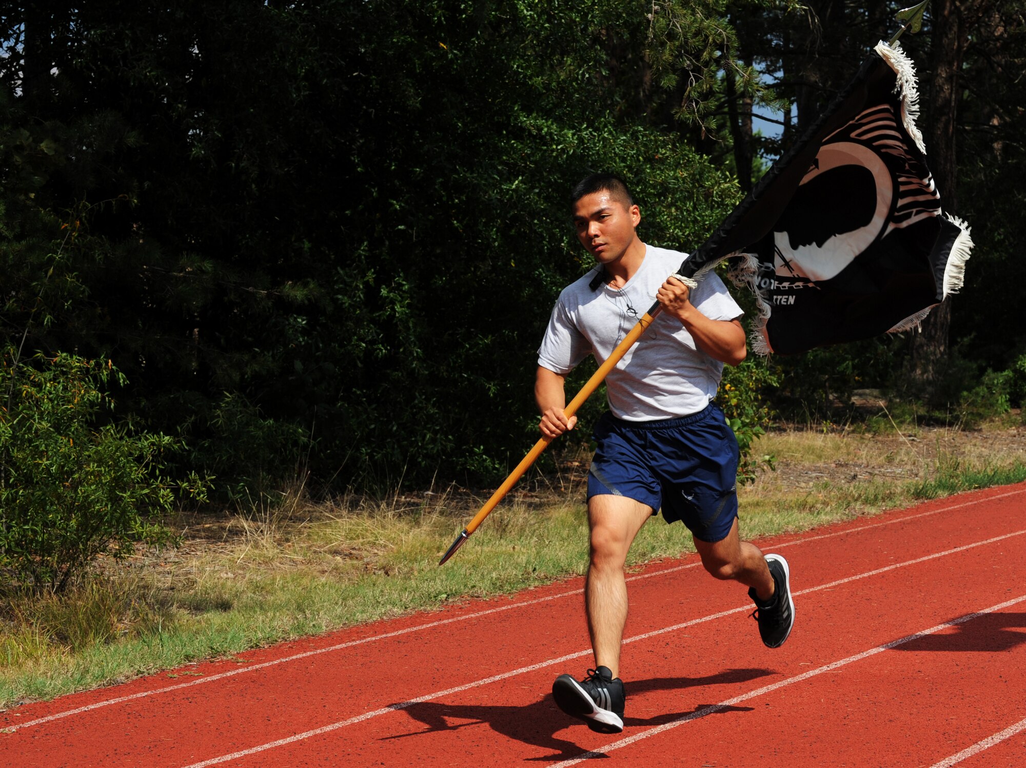Members of Joint Base Andrews participate in the 24-hour POW/MIA Vigil Run here Sept. 18-19. More than 400 military and civilians participated in the run.  During the entirety of the event members carried the POW/MIA Flag around the Virginia track. The run was held to coincide with National POW/MIA Remembrance Day which is held the third Friday of September each year in honor of those who were prisoners of war and those who are still missing in action. (U.S. Air Force photo/Staff Sgt. Nichelle Anderson)