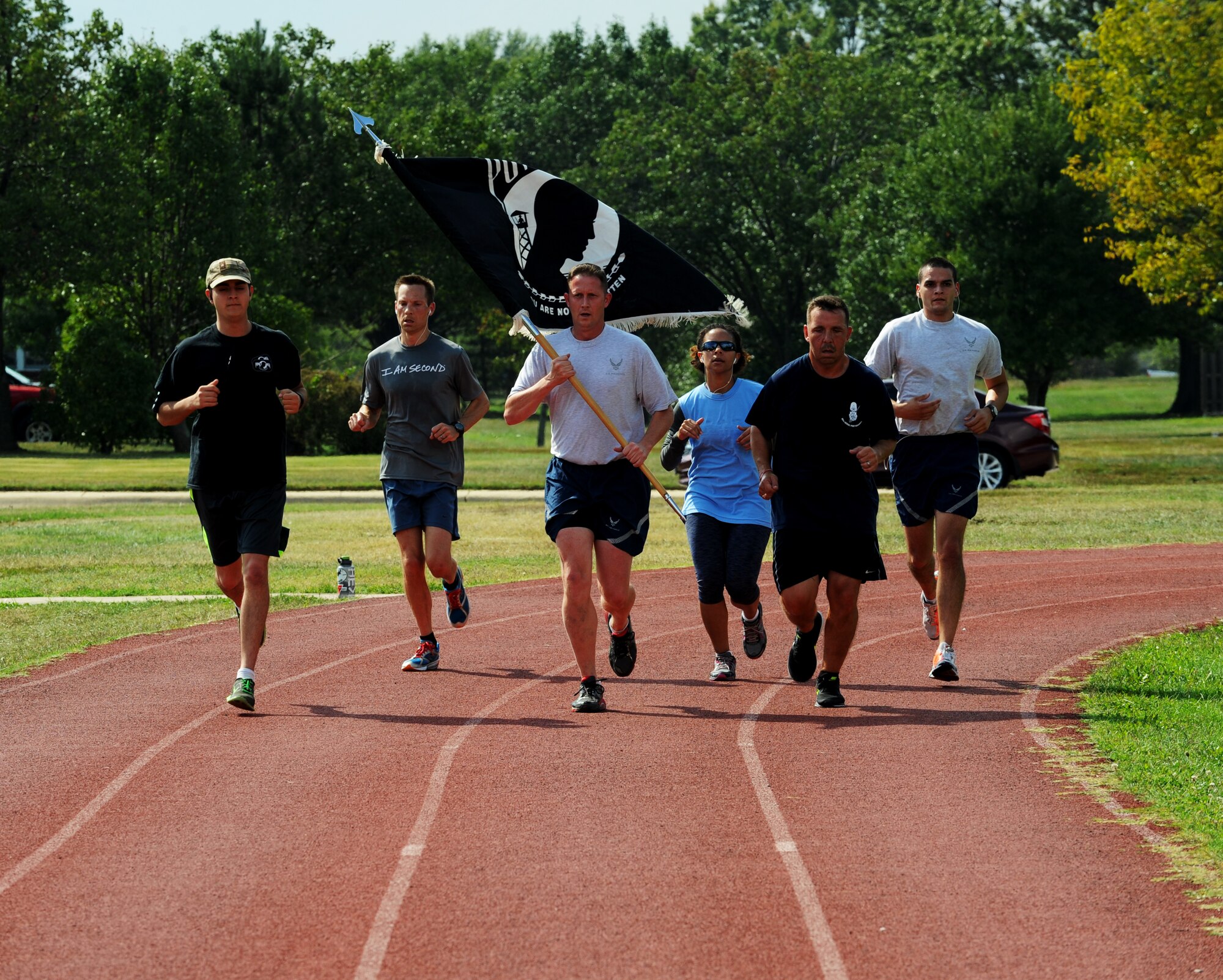 Members of Joint Base Andrews participate in the 24-hour POW/MIA Vigil Run here Sept. 18-19. More than 400 military and civilians participated in the run.  During the entirety of the event members carried the POW/MIA Flag around the Virginia track. The run was held to coincide with National POW/MIA Remembrance Day which is held the third Friday of September each year in honor of those who were prisoners of war and those who are still missing in action. (U.S. Air Force photo/Staff Sgt. Nichelle Anderson)
