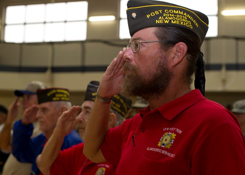 Warren Booker, Veteran of Foreign Wars Tularosa-Alamogordo Post Commander, salutes as TAPS plays at the Prisoner of War, Missing in Action Day of Remembrance ceremony at Holloman Air Force Base, N.M., Sept. 19. Members of Team Holloman paid their respects during the Day of Remembrance by taking shifts with the POW/MIA flag, running a total of 24 hours, and standing a 24 hour guard at the POW/MIA memorial in Heritage Park. “It’s important that we never forget,” said Booker. “Those who forget are bound to repeat.” (U.S. Air Force photo by Senior Airman Leah Ferrante/Released)
