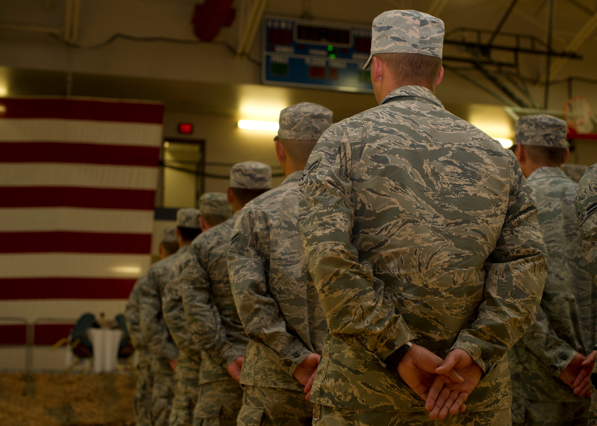 Members of Team Holloman stand in formation for the Prisoner of War, Missing in Action Day of Remembrance ceremony at Holloman Air Force Base, N.M., Sept. 19.  Members of Team Holloman paid their respects during the Day of Remembrance by taking shifts with the POW/MIA flag, running a total of 24 hours, and standing a 24-hour guard at the POW/MIA memorial in Heritage Park. “We need to always remember the sacrifices of those that have gone before us,” said Col. Robert Kiebler, 49th Wing commander. “We will never forget, and we will never rest until all of those accounted for are returned home.” (U.S. Air Force photo by Senior Airman Leah Ferrante/Released)