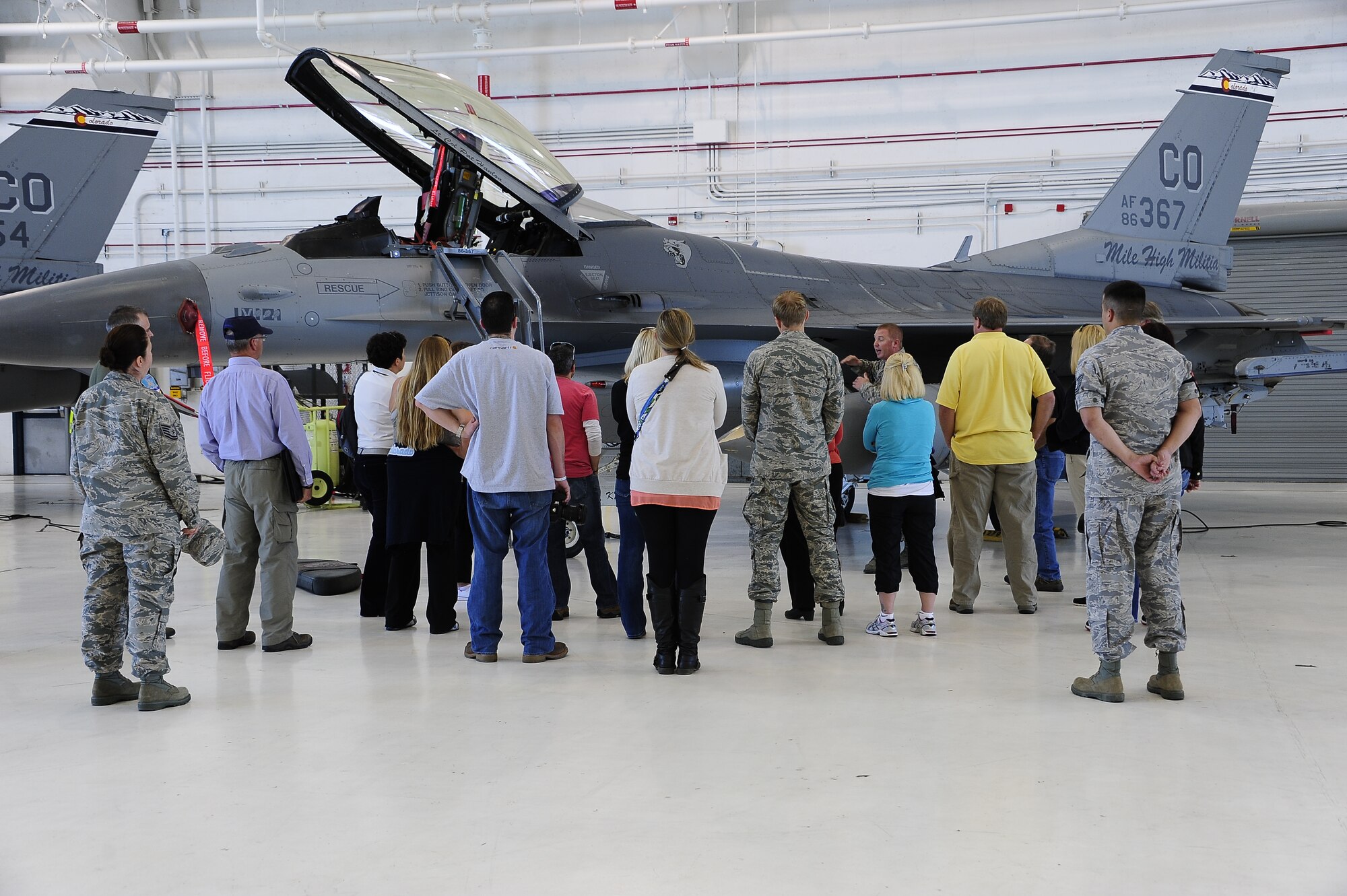 Employers of traditional Colorado National Guardsmen tour the F-16 hangar located at Buckley Air Force Base, Colo., September 13, 2014. The Colorado Employee Support of the Guard and Reserve hosted an ‘Employer’s Day’ for members of our community who were nominated by an employee and member of the Colorado National Guard.  Founded in 1972, ESGR promotes free education, consultation, and if necessary, mediation for employers of Guard and Reserve employees. Its goal is to support America’s employers who share their employees with the nation to ensure U.S. national security. (Air National Guard photo by Staff Sgt. Nicole Manzanares)
